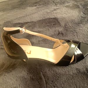 Shiny black open toed heels